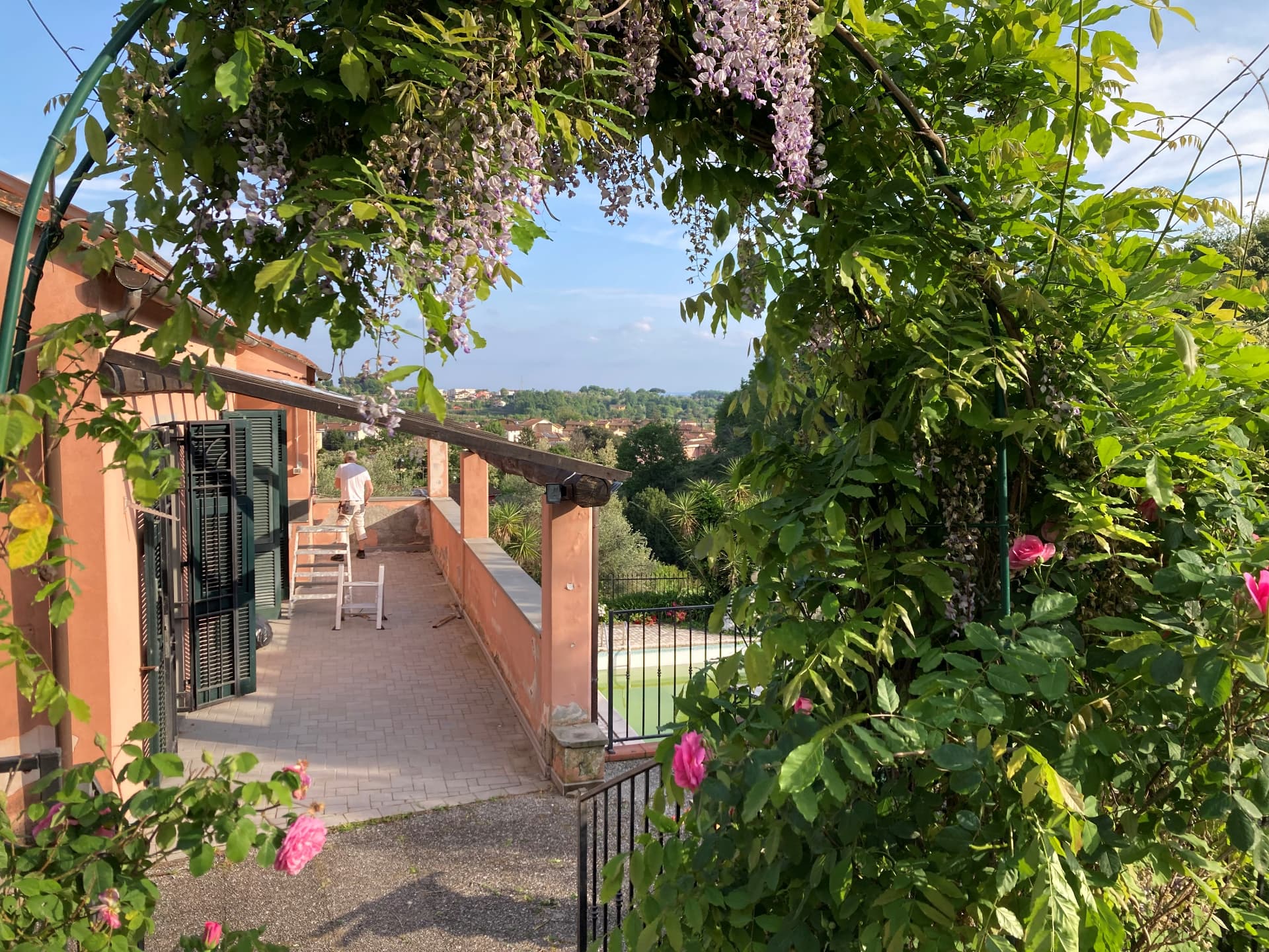 The Casa Amica terrace with wisteria and roses