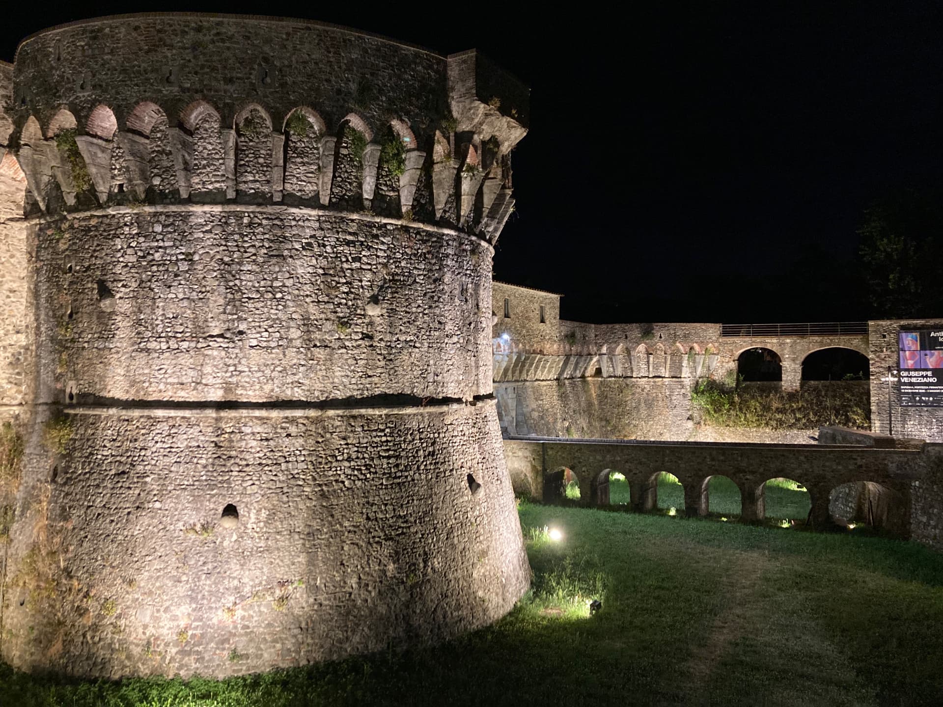 The fortress of Sarzana lit up at night